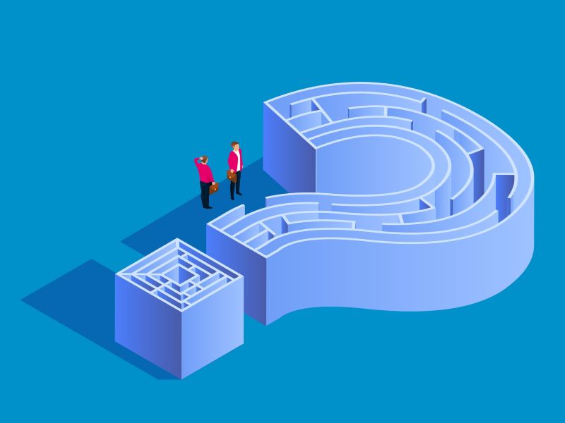 Two business people navigating through a maze shaped as a question mark