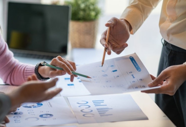 executives at a healthcare facility reviewing capital capacity reports executives at a healthcare facility reviewing capital capacity reports